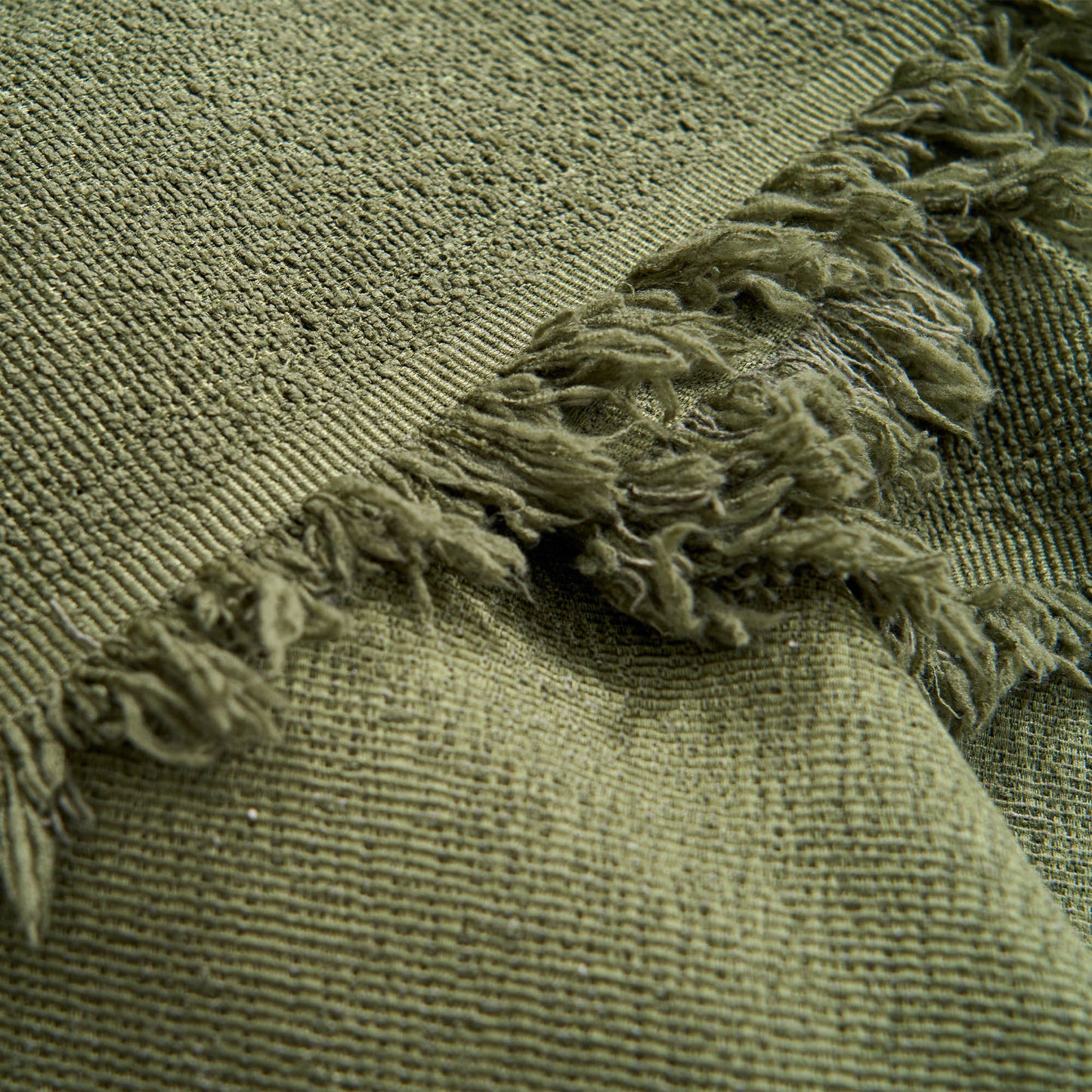 Copridivano impermeabile con bordo a nappa per protezione e stile